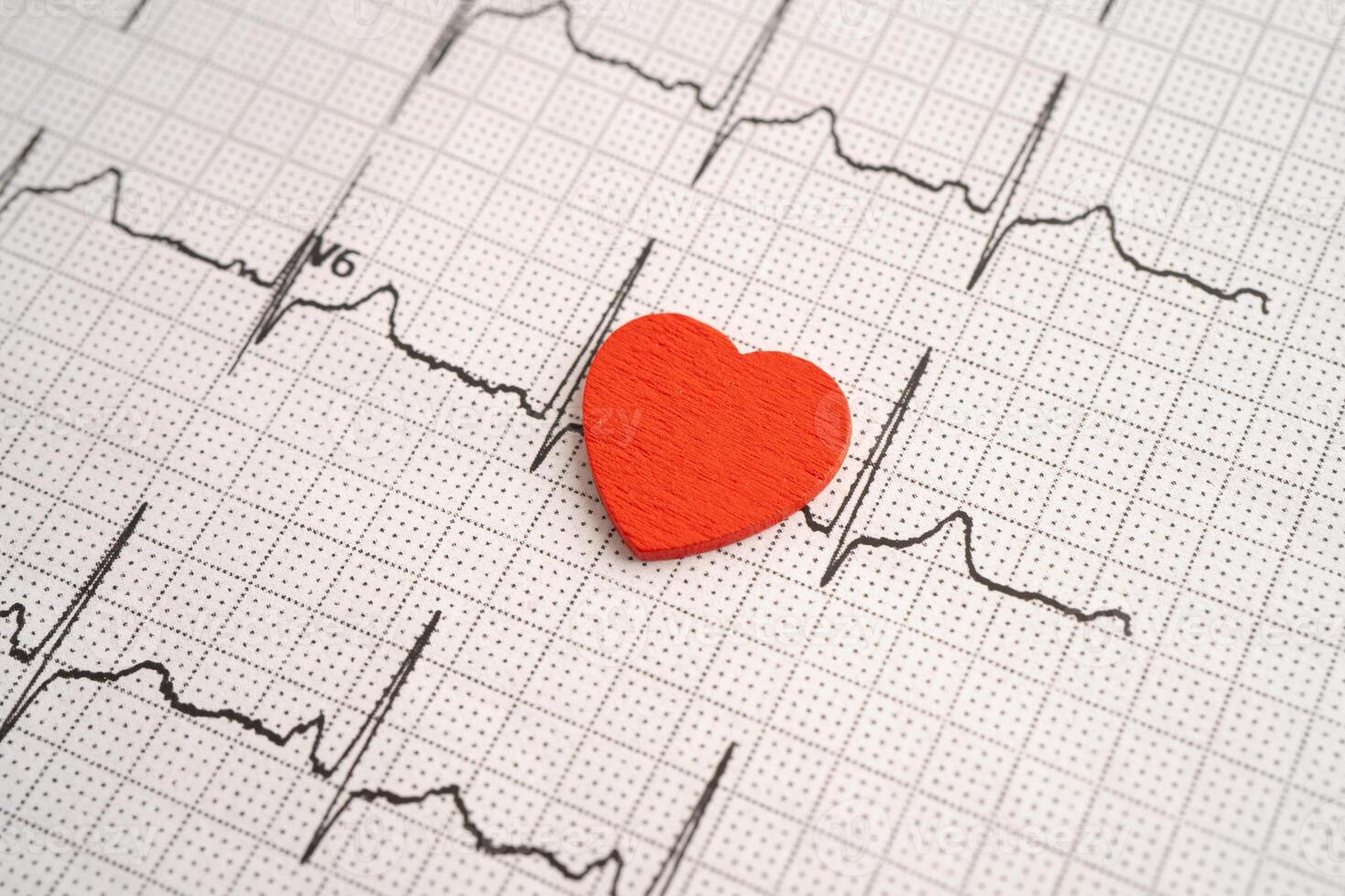 Red heart on electrocardiogram ECG with red heart, heart wave photo