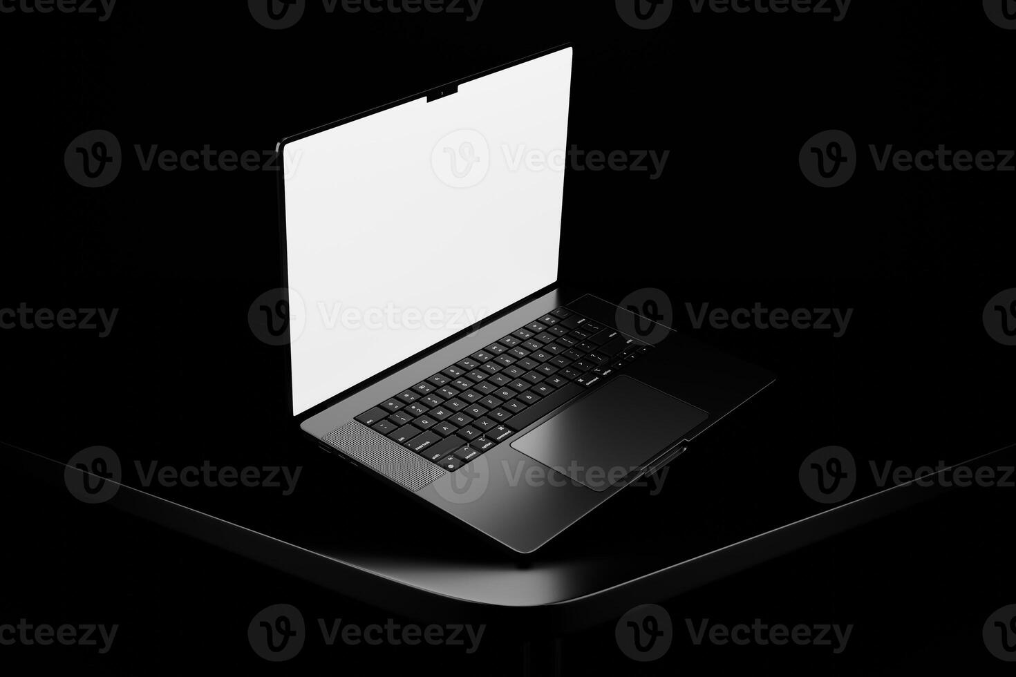 A laptop with a blank screen on a black surface photo