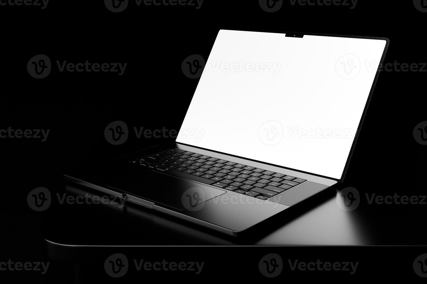 A laptop computer with a blank screen on a table photo