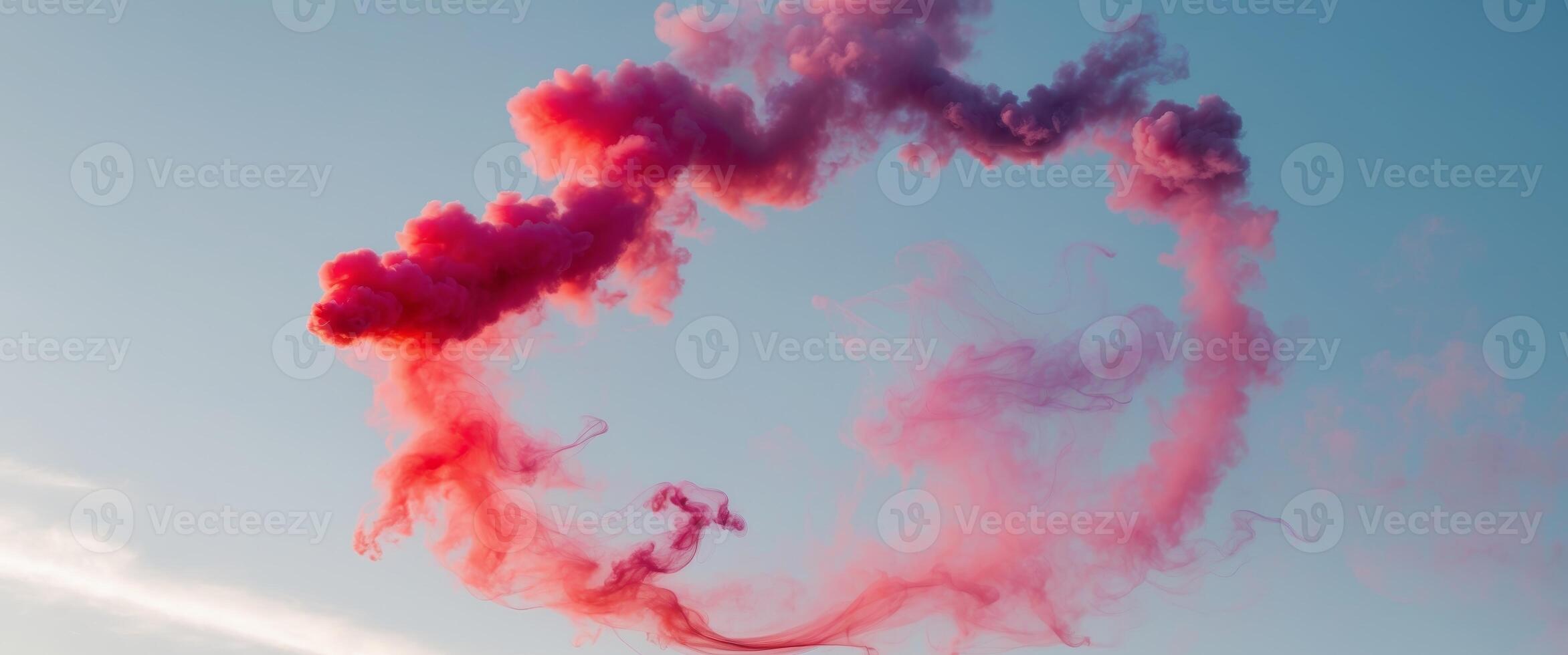 A circle of red and purple smoke is floating in the sky. photo