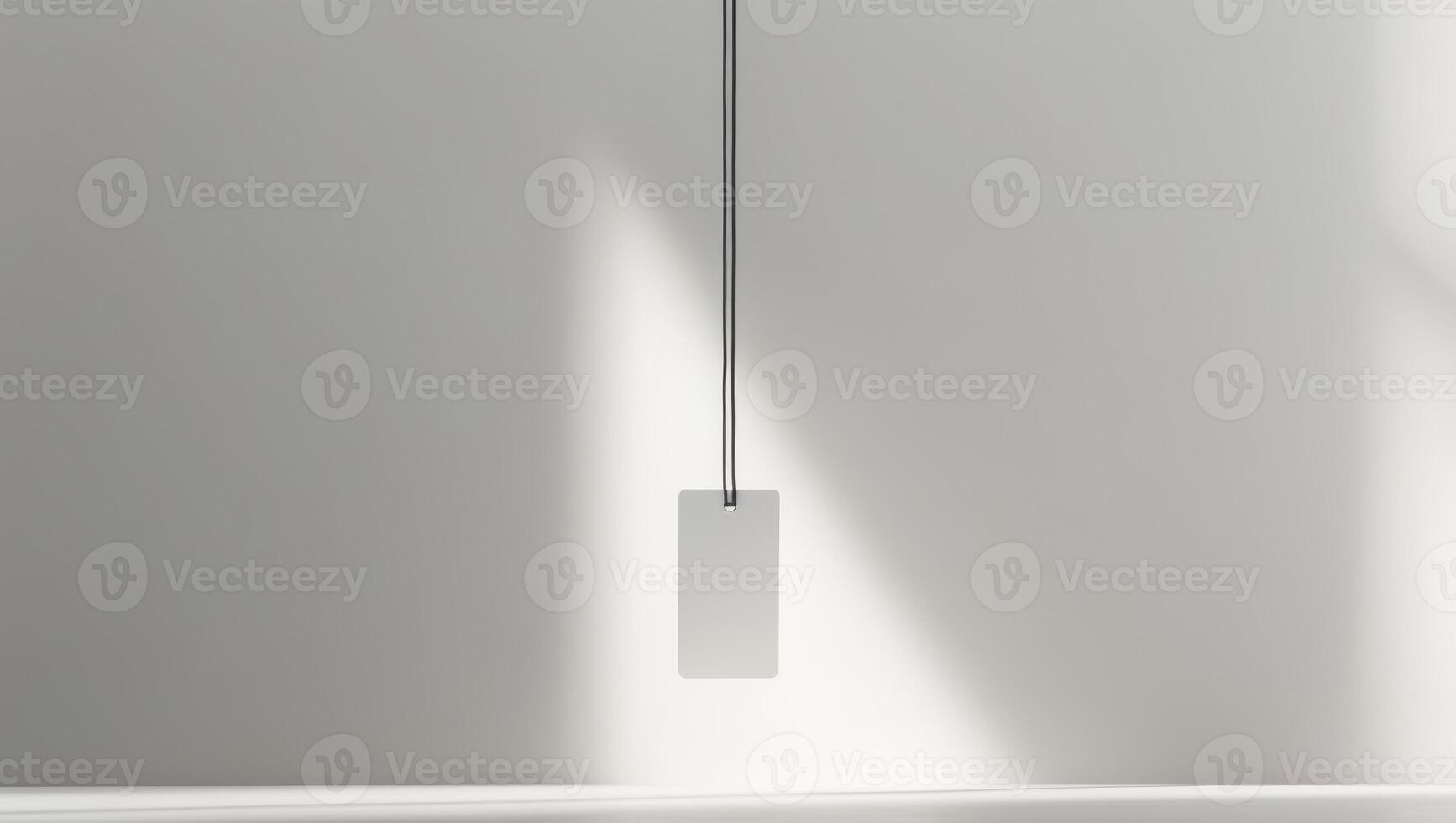 A white tag with a black band is hanging on a table. photo