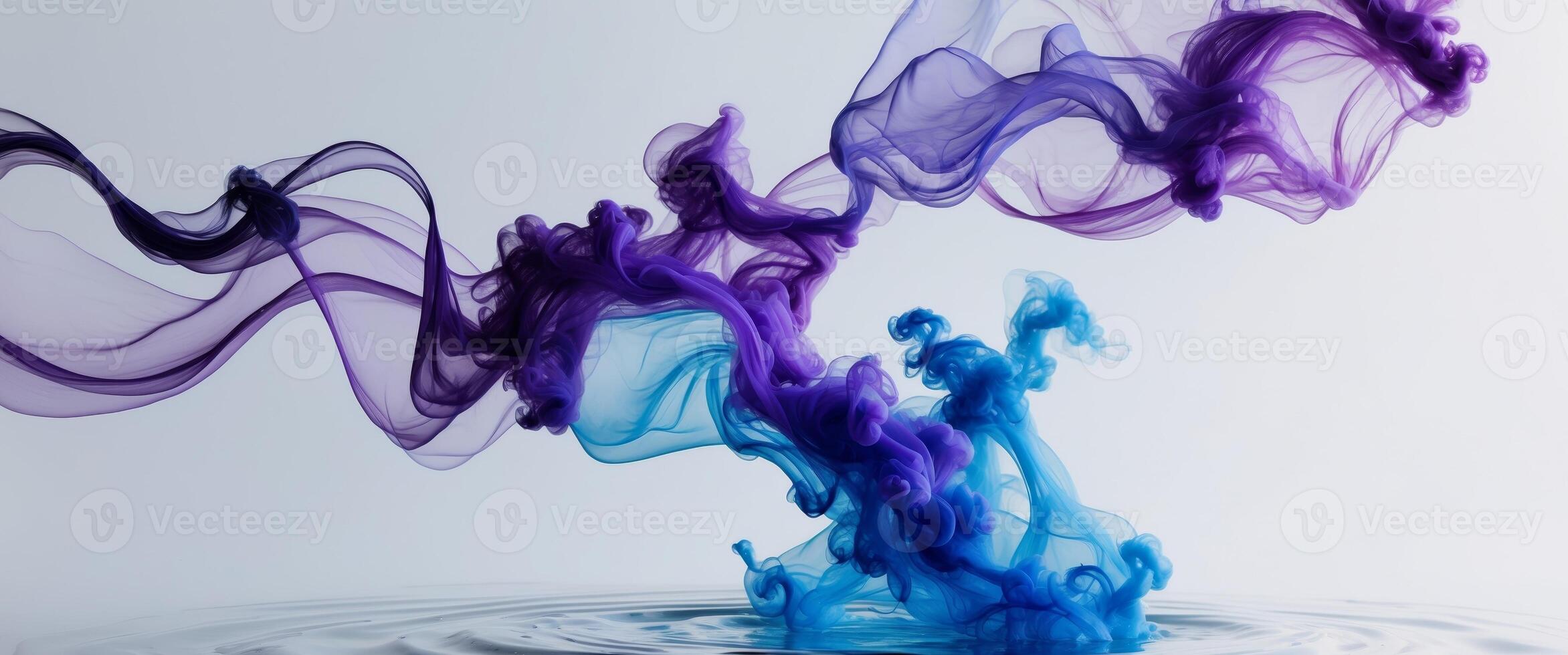 Abstract Purple and Blue Ink Swirls in Water. photo
