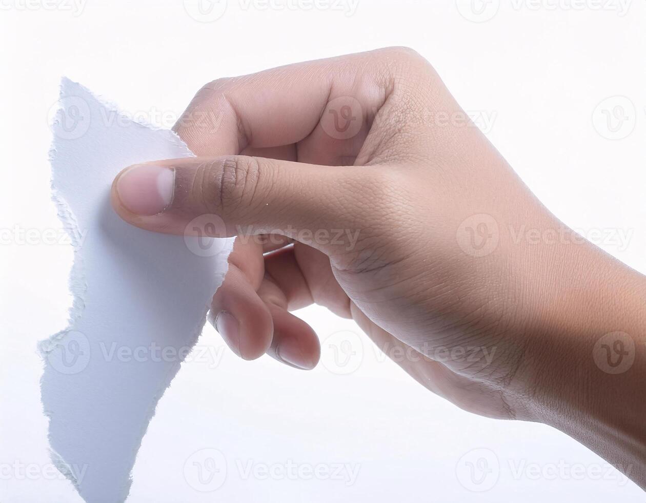 Close-Up of Hands Tearing a Paper Document Against White Background photo