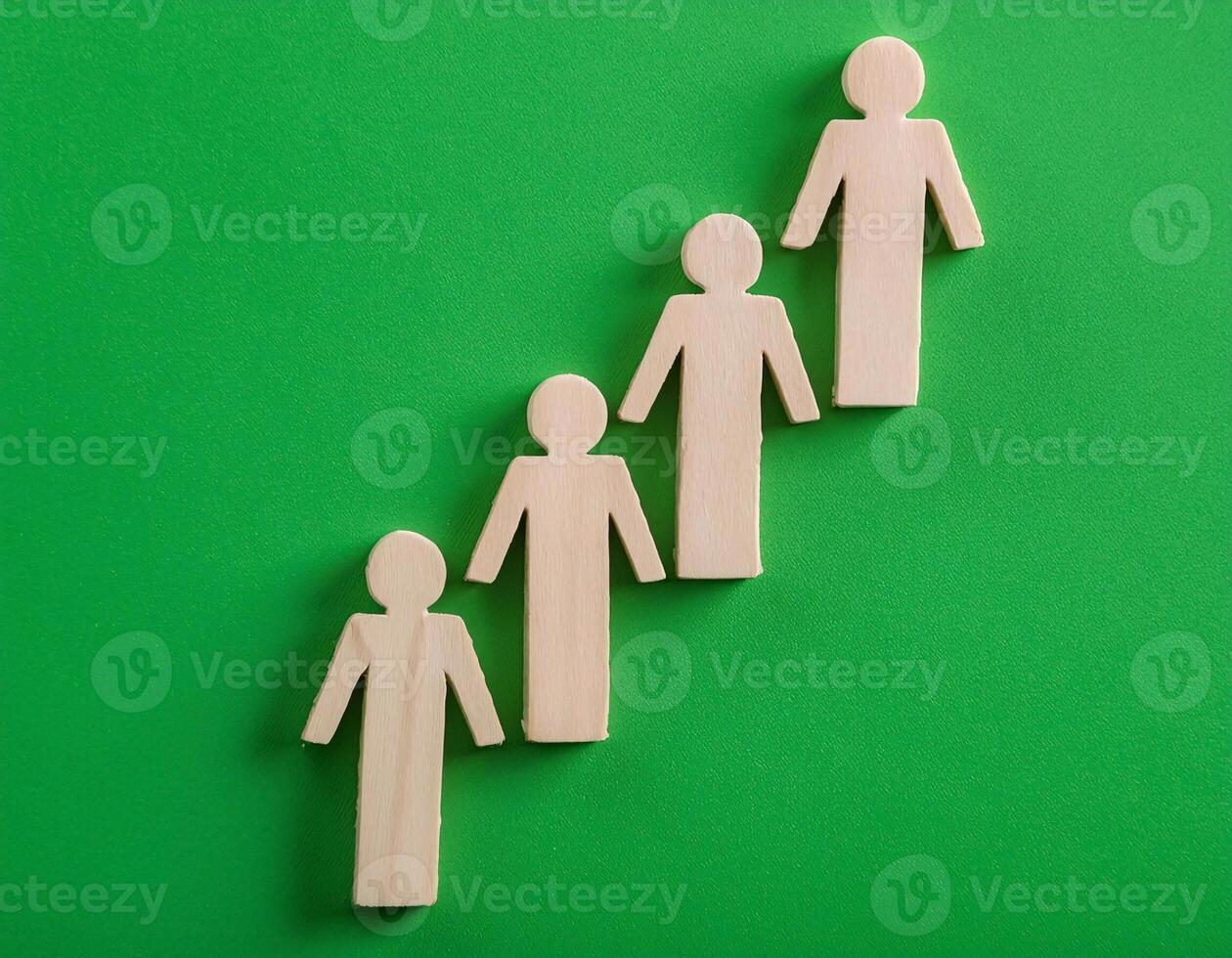Wooden Figurines Climbing a Steep Path Symbol of Leadership and Growth photo