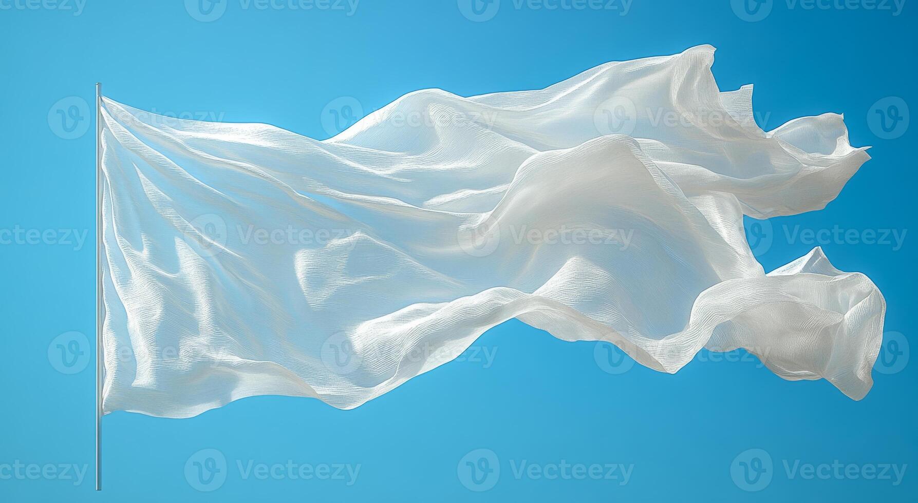 White flag waving under a clear blue sky. A light, flowing white flag flutters gracefully against a bright blue sky, creating a peaceful atmosphere. photo