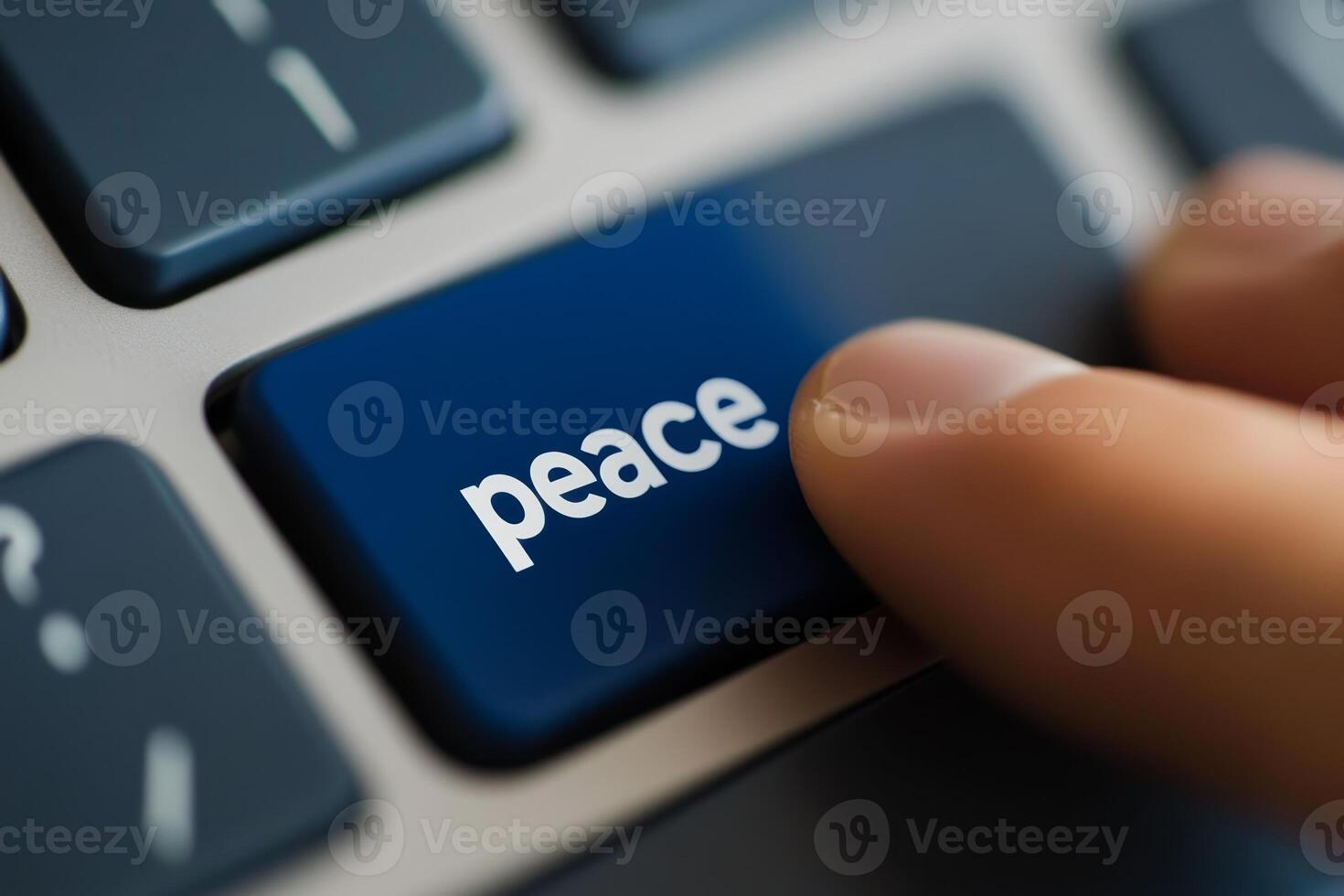Focused finger pressing peace key on modern keyboard reflecting the importance of harmony in communication photo