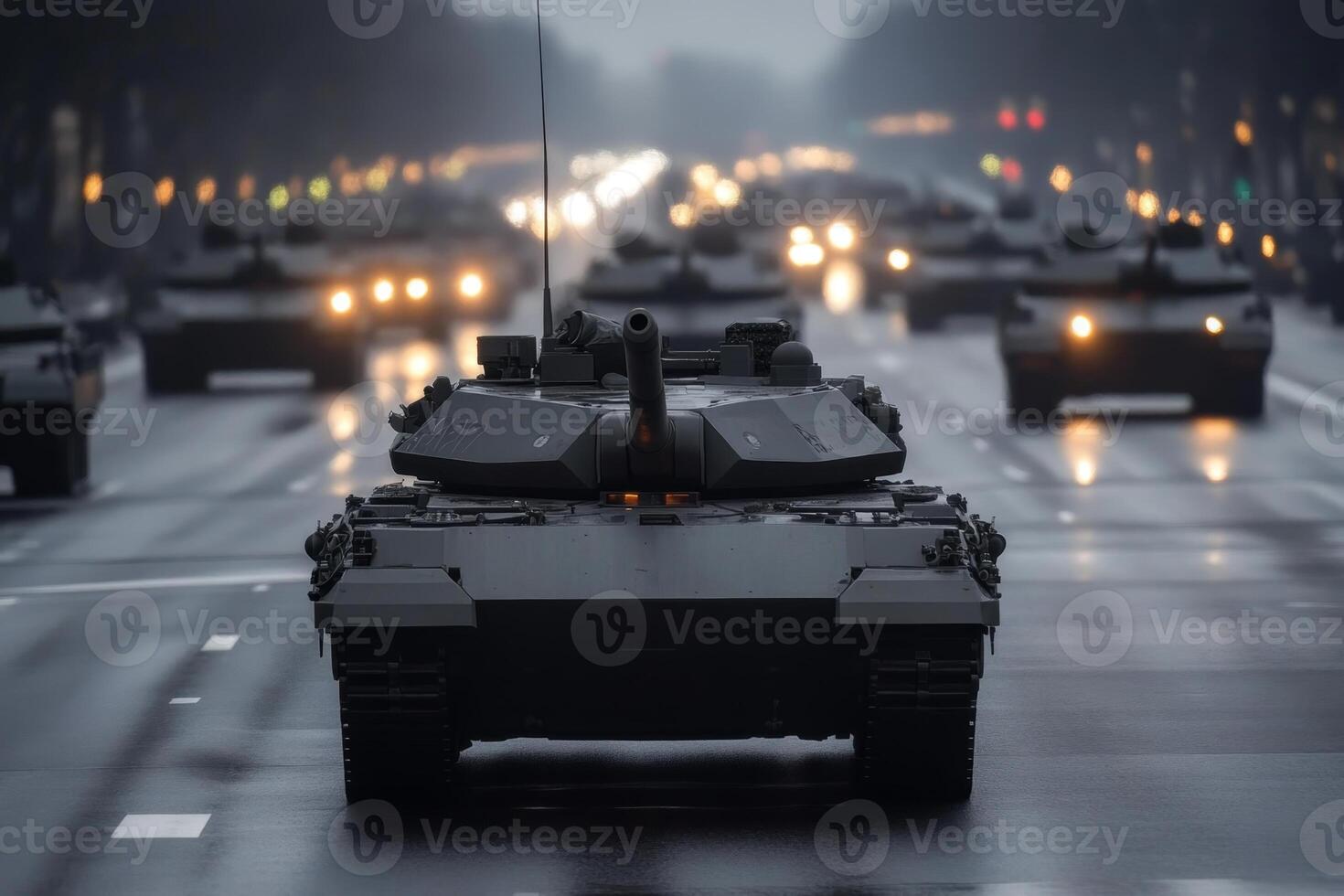 Military tanks move down a city street during an evening parade amid cloudy weather photo