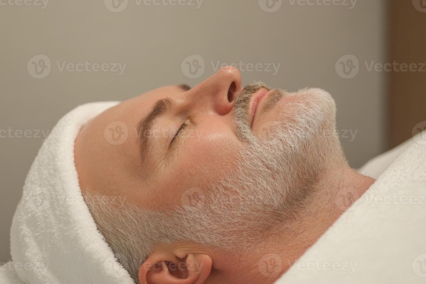 Man relaxing during a facial treatment at a spa, enjoying a serene moment of self-care and rejuvenation photo