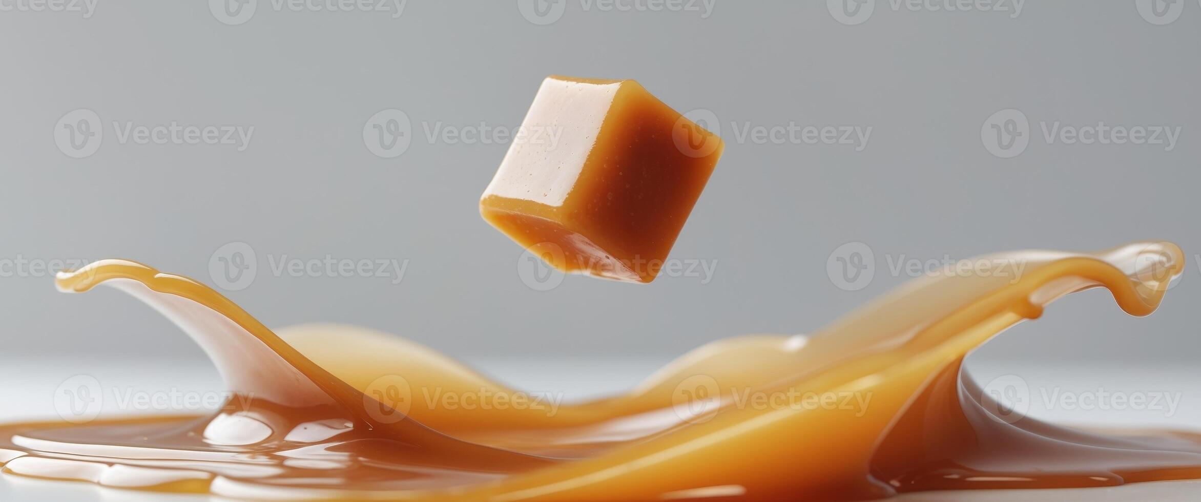 Delicious Caramel Cube Splashing in Liquid Caramel photo