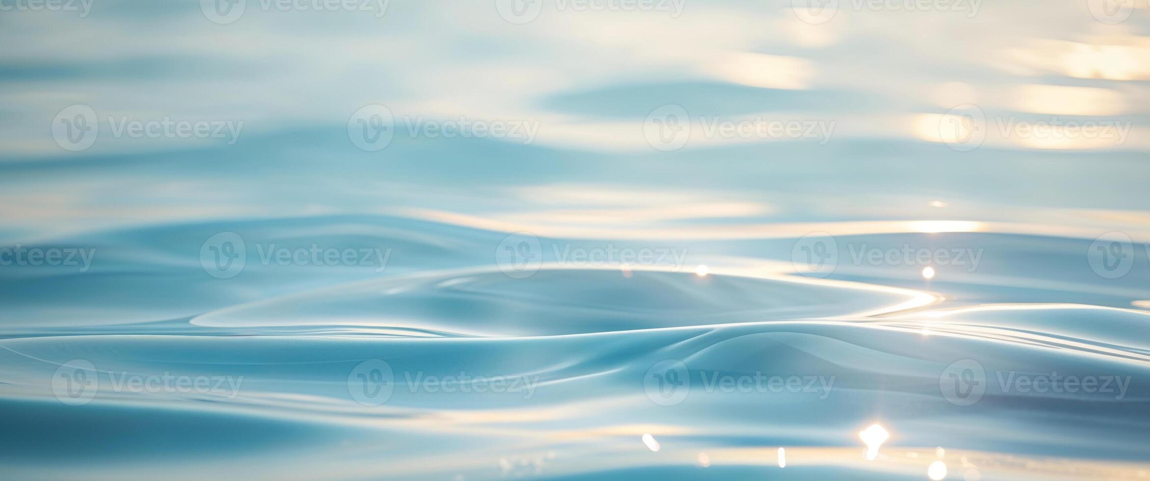 Rippling blue water surface reflecting sunlight in a calm setting. photo