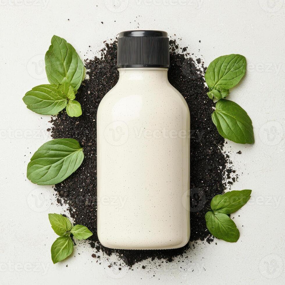 Natural yogurt bottle surrounded by fresh basil leaves on a rustic surface. photo