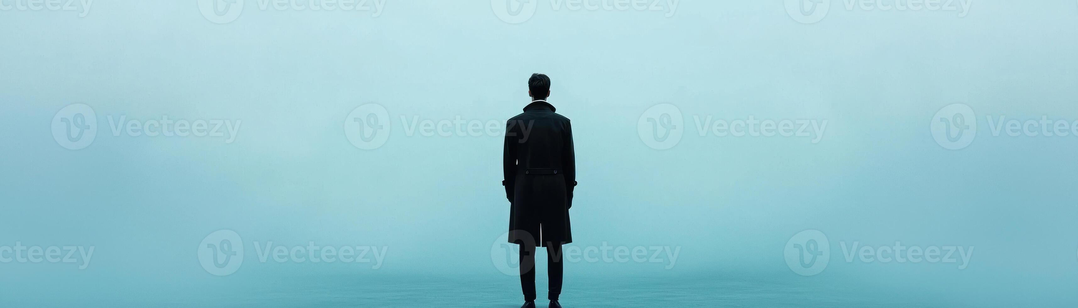 A solitary figure stands in a serene, misty atmosphere, evoking contemplation. photo