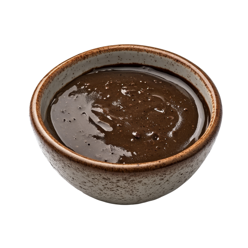 Mole poblano sauce in a textured bowl against a clean transparent background showcasing its rich color and smooth texture, mole poblano sauce on bowl isolated on transparent background png