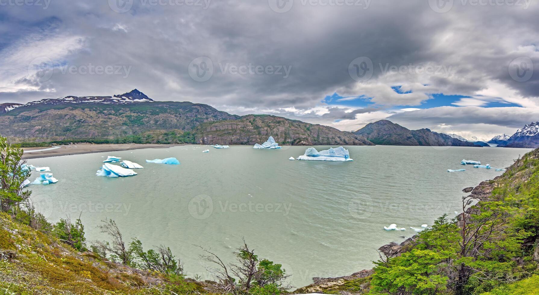 Lago Grey with floating icebergs and stunning mountain backdrop in Torres del Paine National Park qa photo