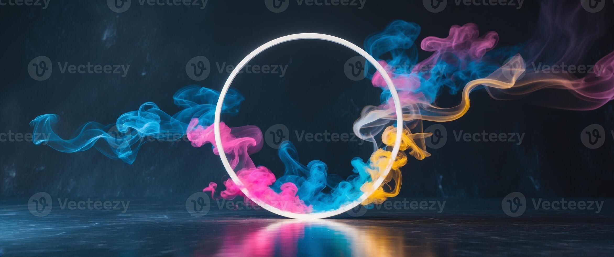 Abstract illuminated circle with colorful smoke in dark background. photo