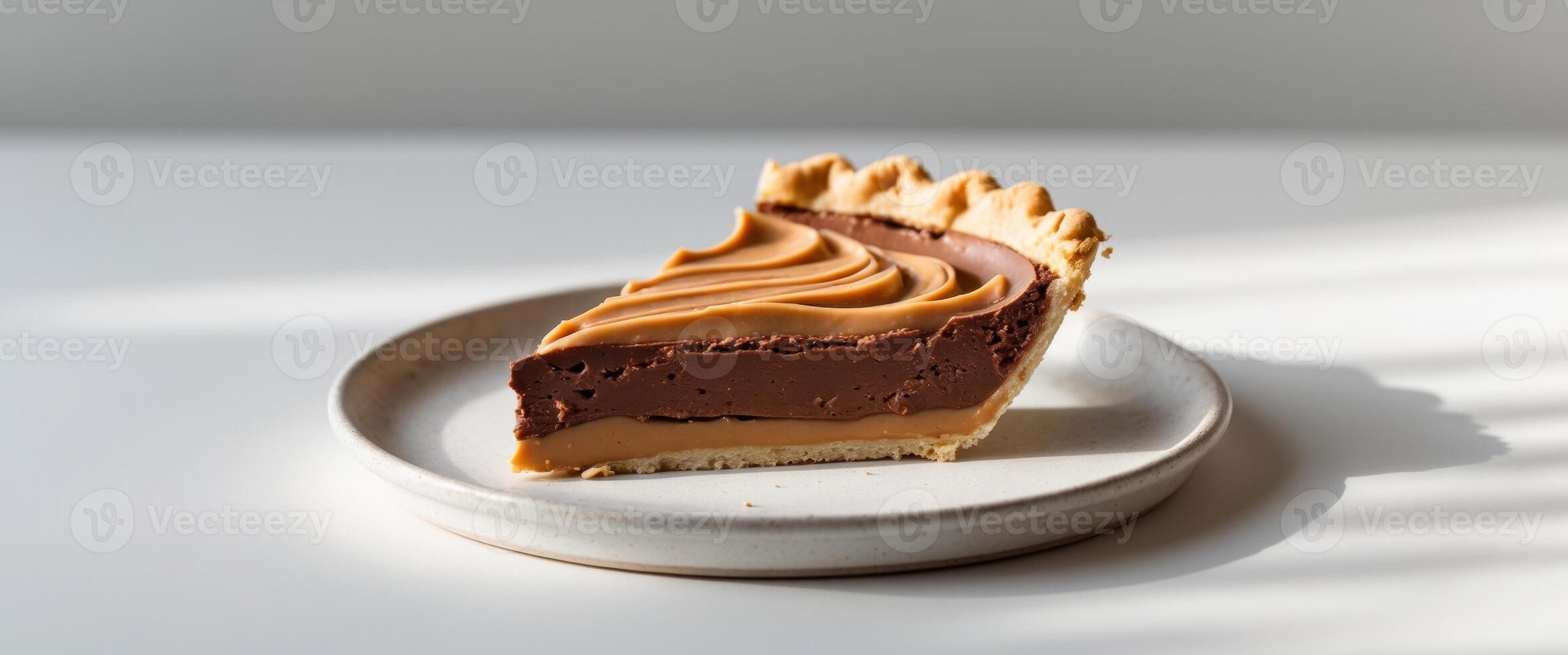 Delicious slice of chocolate peanut butter pie on plate. photo