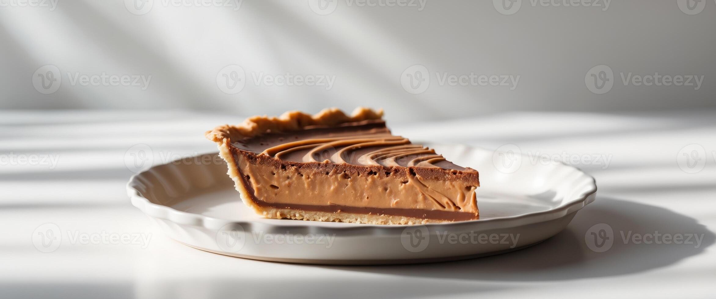 Delicious slice of chocolate peanut butter pie on plate photo