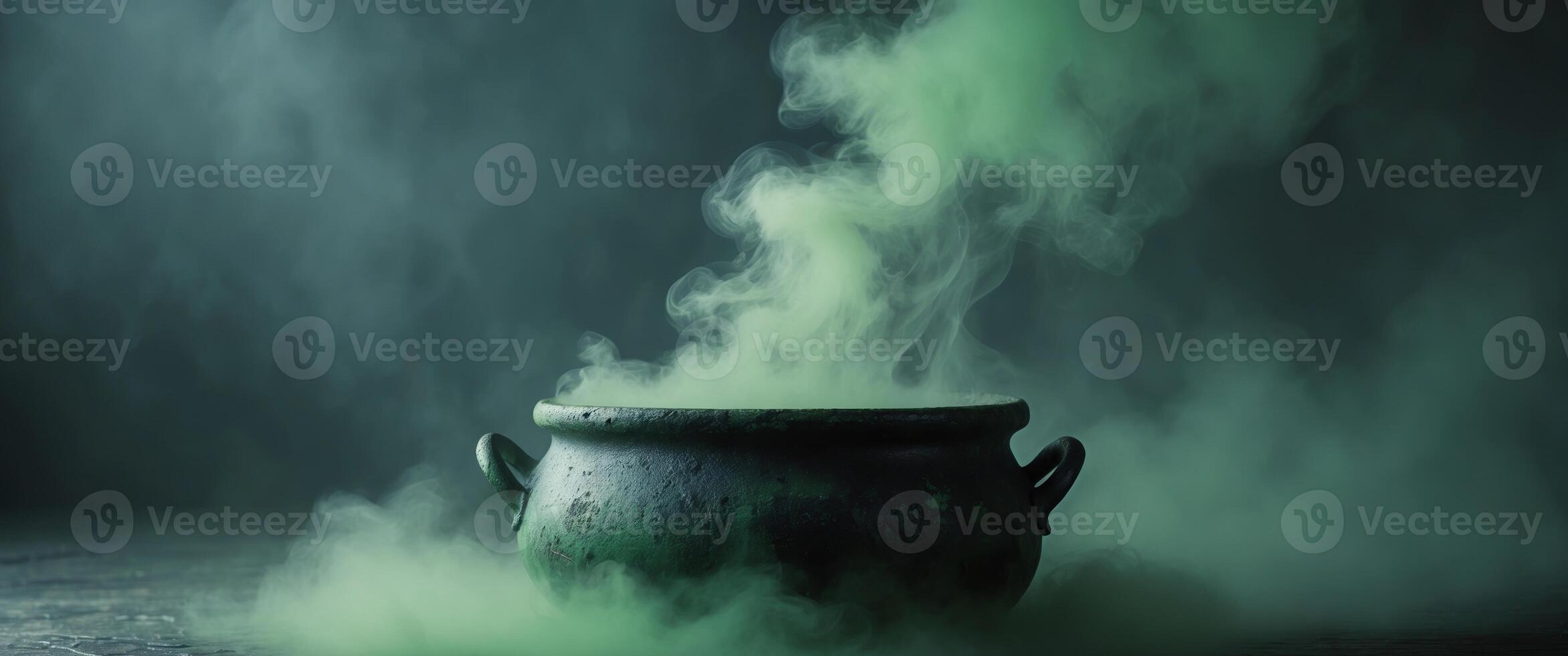 Green mist rising from a bubbling cauldron in a dark and mysterious setting photo