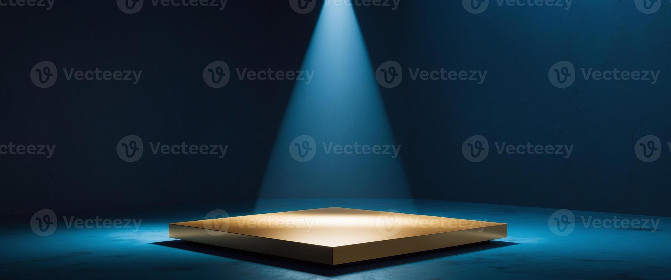 A dark blue background with a spotlight shining down on a gold platform. photo