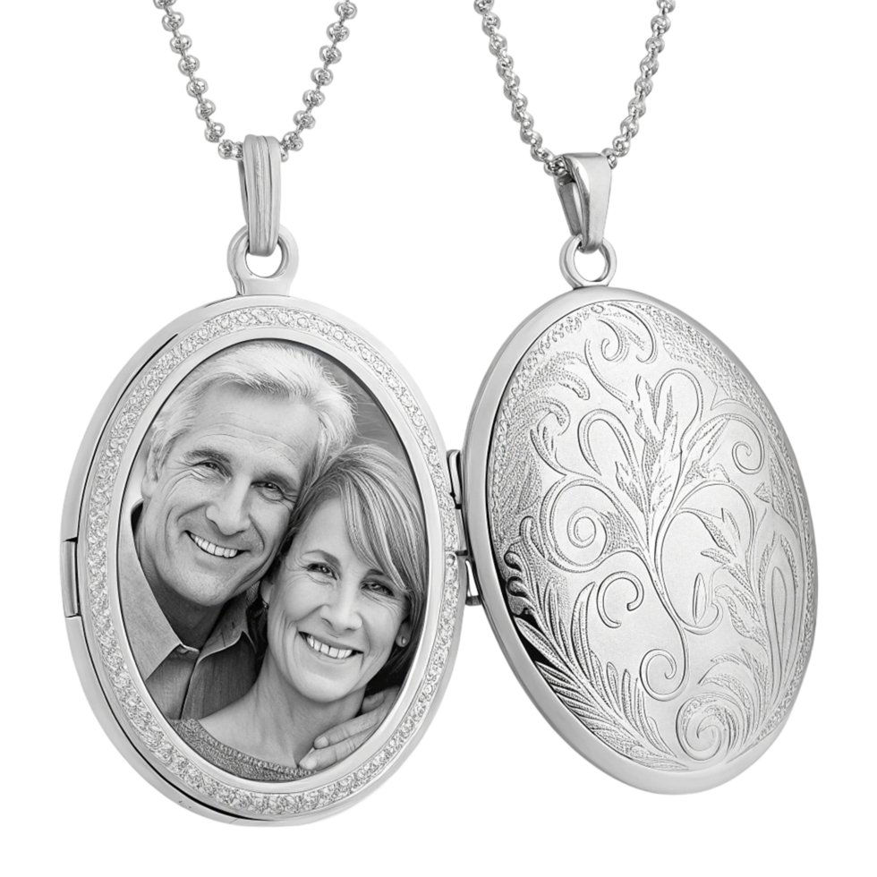 A couple is shown in a silver locke with a photo on it png