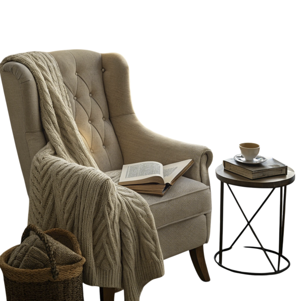 A chair with a blanket and a book on a table png