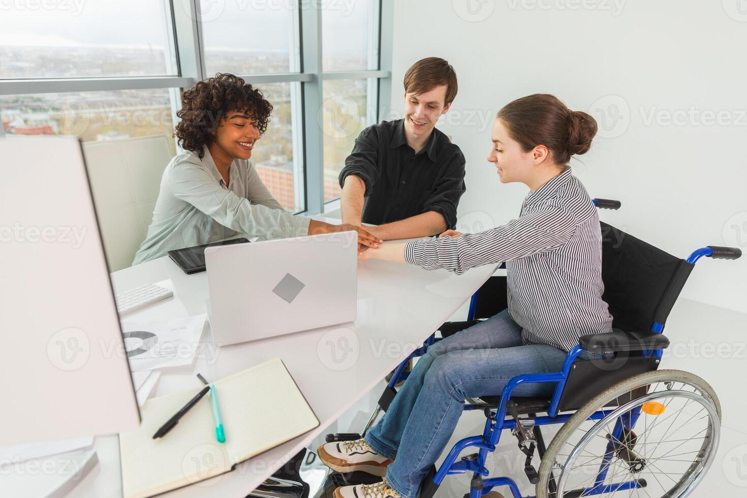 Stack of hands. Business startup teamwork unity concept. Top view of diverse multiracial business people putting hands together. Business colleagues during work process rejoice in success of company photo
