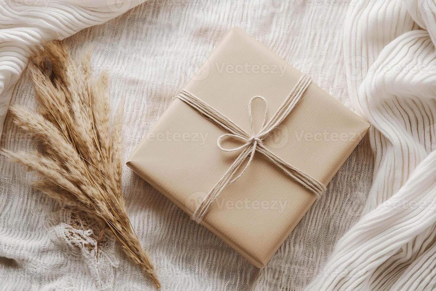 Kraft paper packaging mockup with decorative twine and dried gra photo