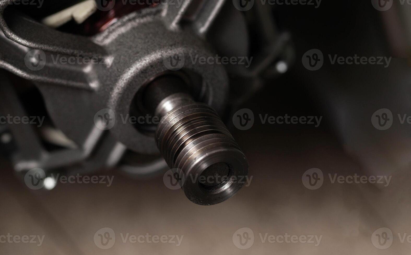 The belt fell off the pulley of the electric motor of the washing machine. Repair of washing machines, close-up. Copy space for text photo