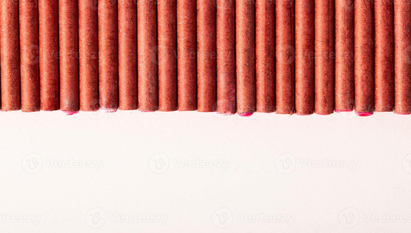 A bunch of firecrackers with red sulfur. Set of pyrotechnics, explosion hazard, macro. Copy space for text photo