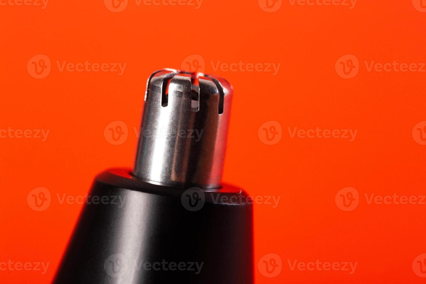 Modern trimmer attachment for removing nose hair, close-up. Copy space for text photo