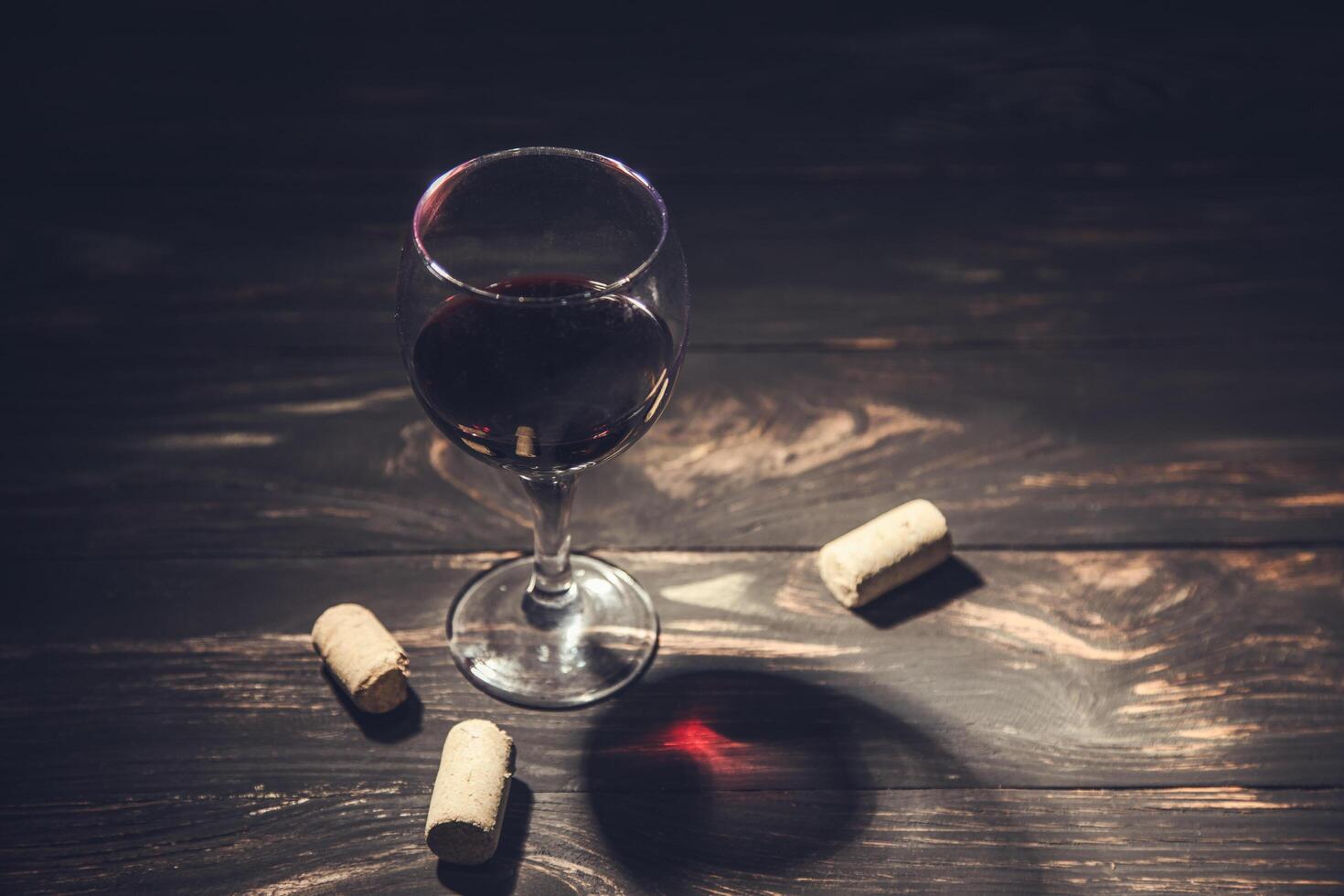 glass of wine and corks photo