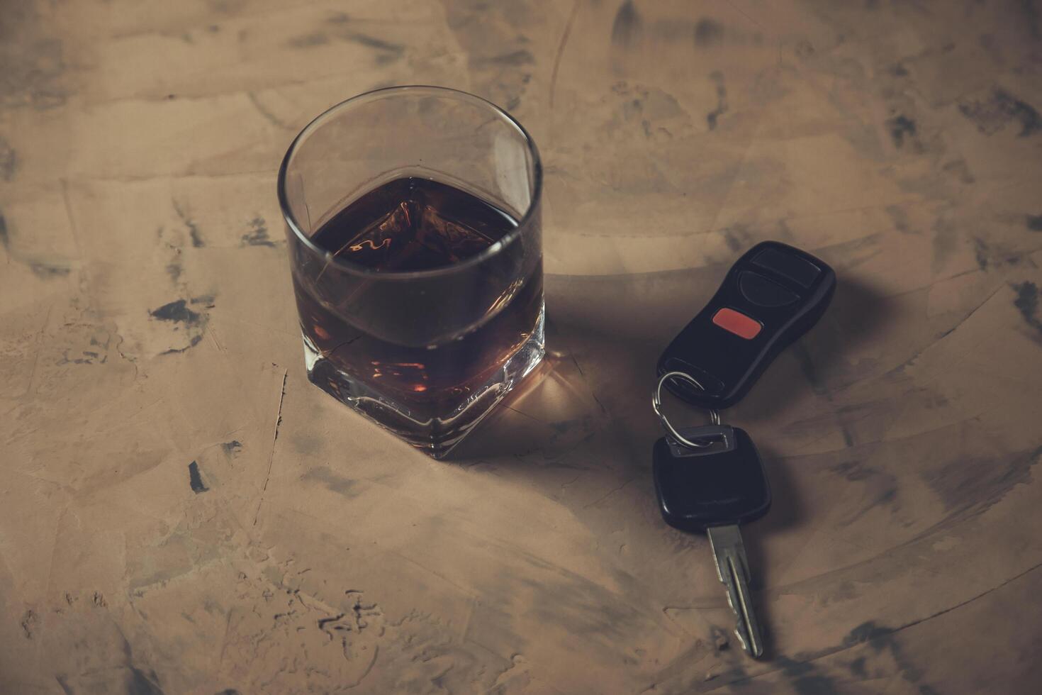glass of whiskey and car key, photo