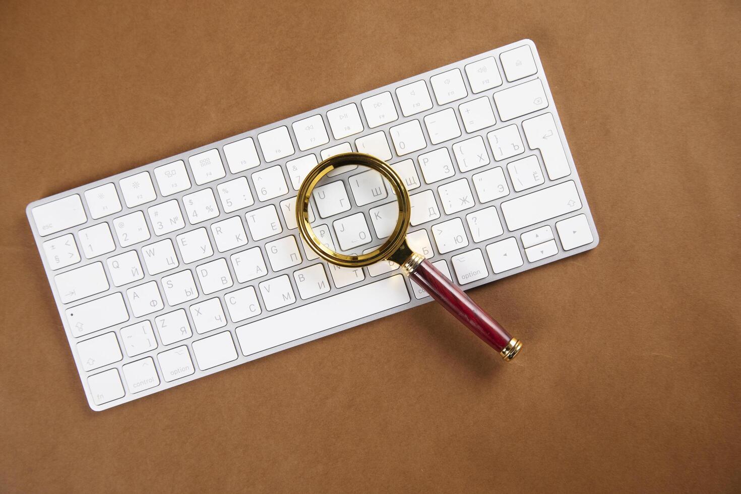 magnifier on computer keyboard photo