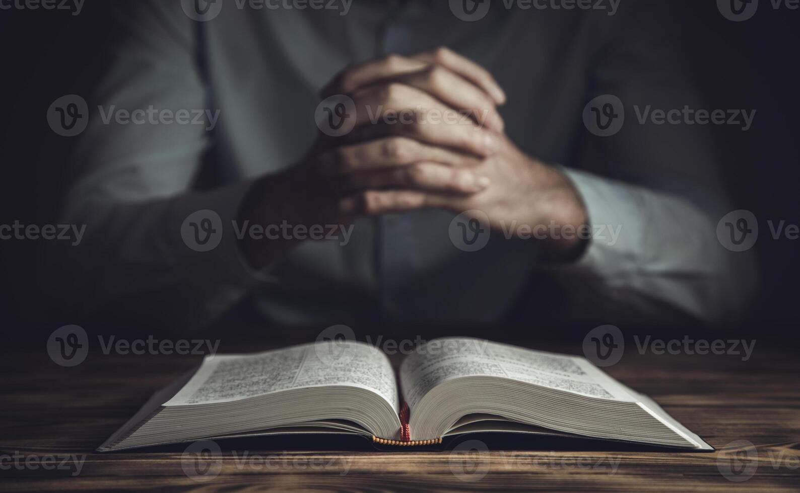 prayer hands on a Holy Bible photo