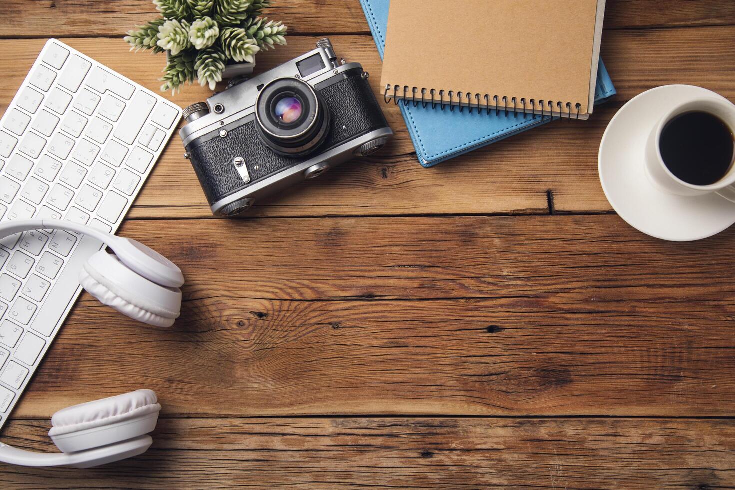 earphone with keyboard and notepad with camera photo