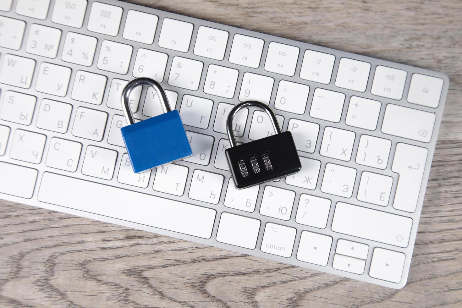 Two padlock on a keyboard photo