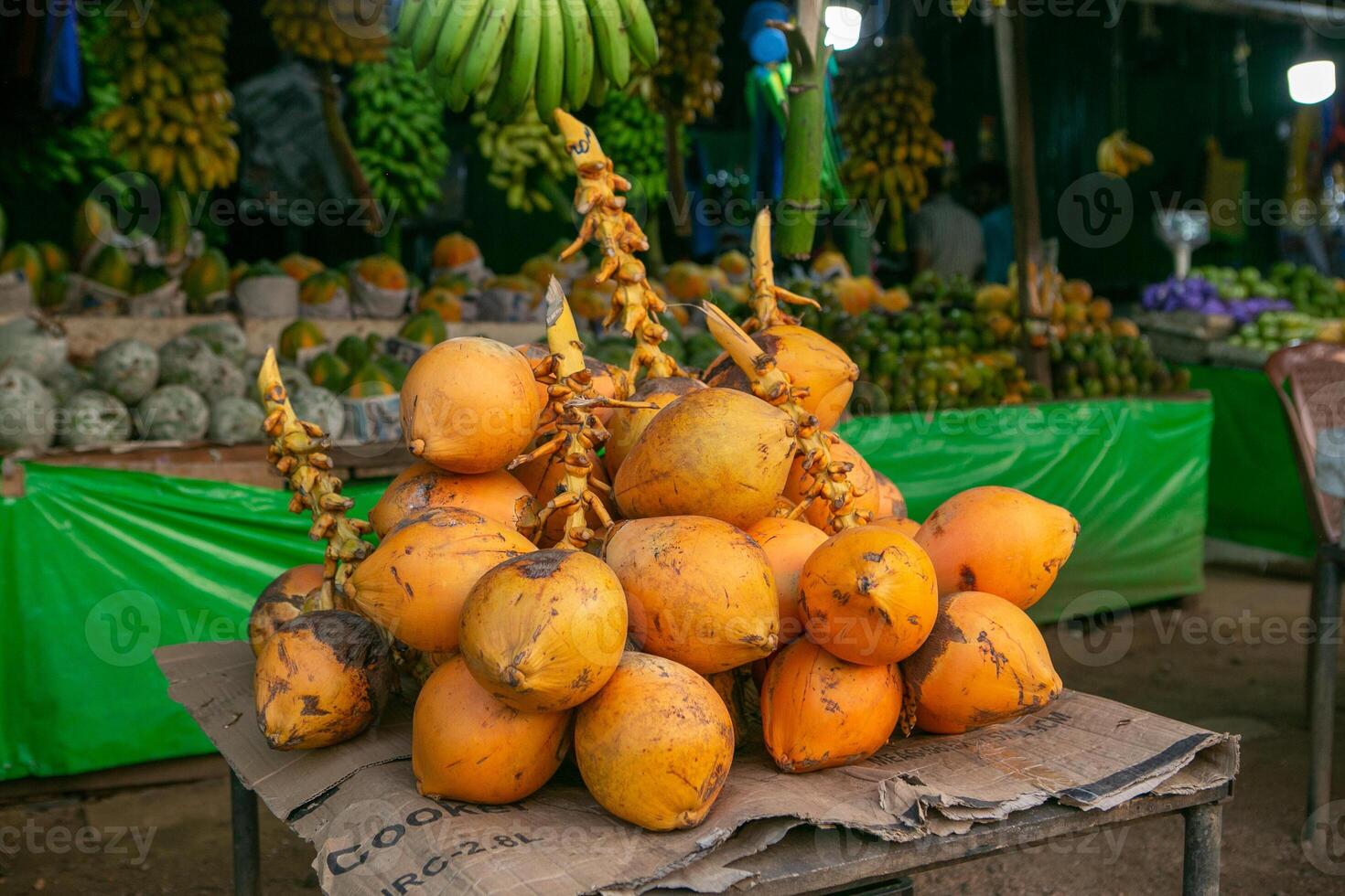 yellow coconut in season in sri lanka at the local market photo