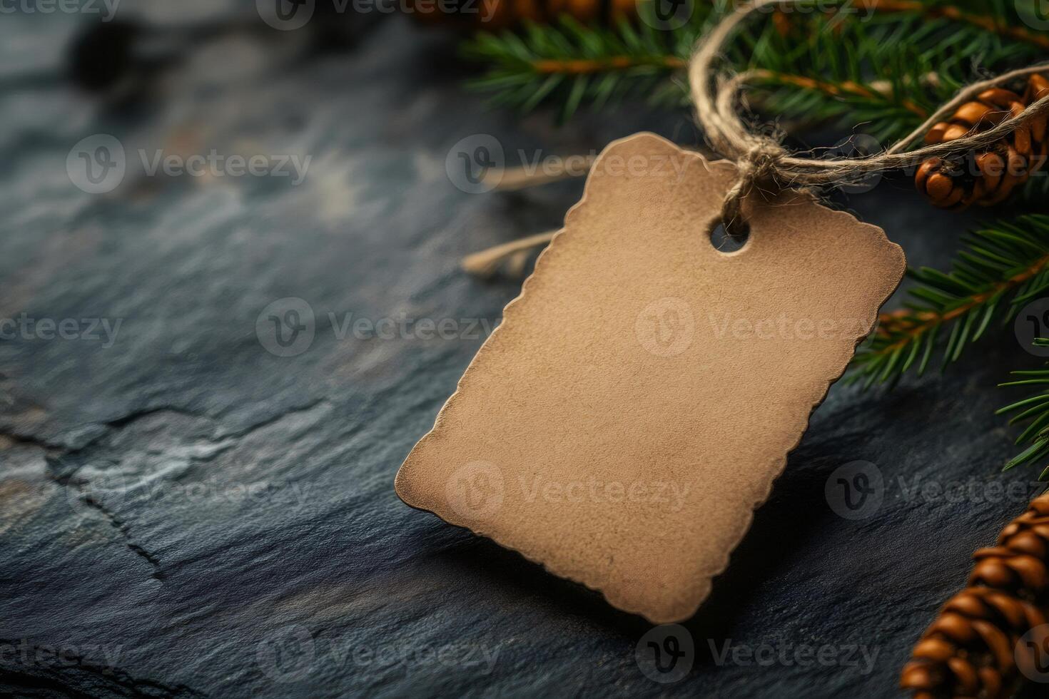 Christmas label mockup tied with natural twine on dark stone background photo