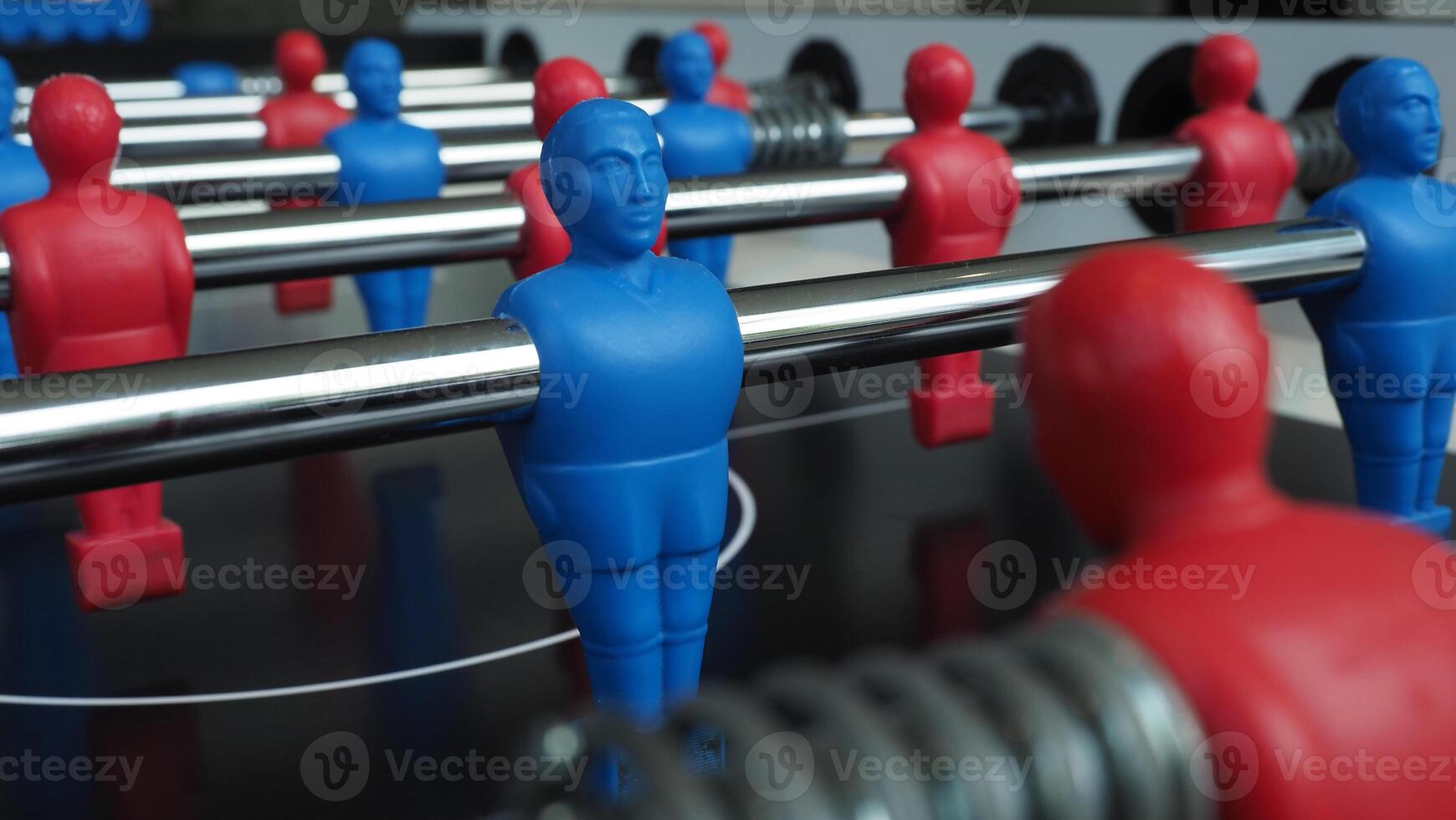 Football table or soccer table game with plastic player figurine. Mini Soccer game which famous in past and be collectable item for foosball lover. Play by two hand control each row of player photo