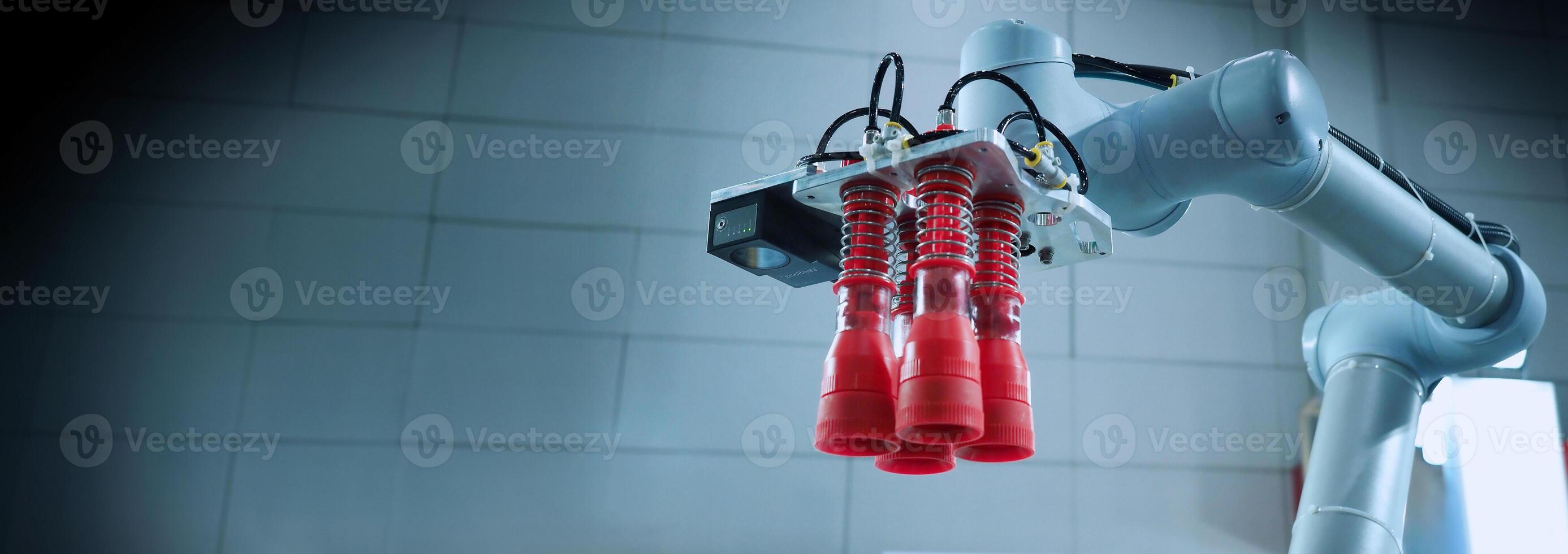 Robot arms Automation technology. Tools for saving energy effort and making the work of engineers more convenient in modern factories. Automation factory tech concept with robotic arms lifting goods. photo