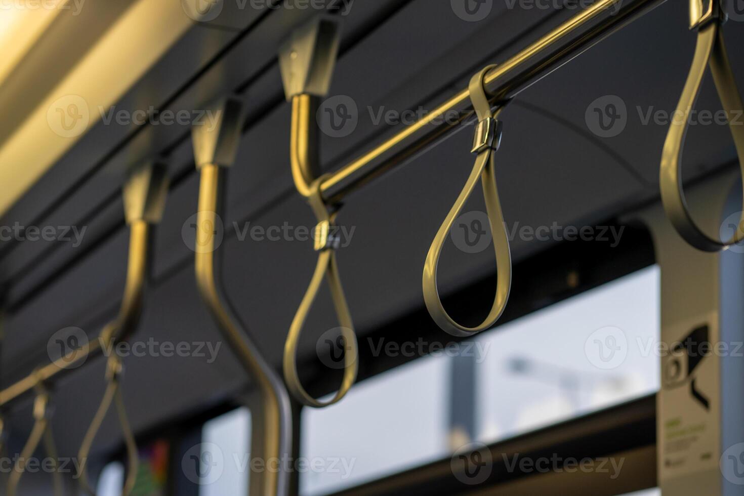 View of the upper handrail loops in public transport photo