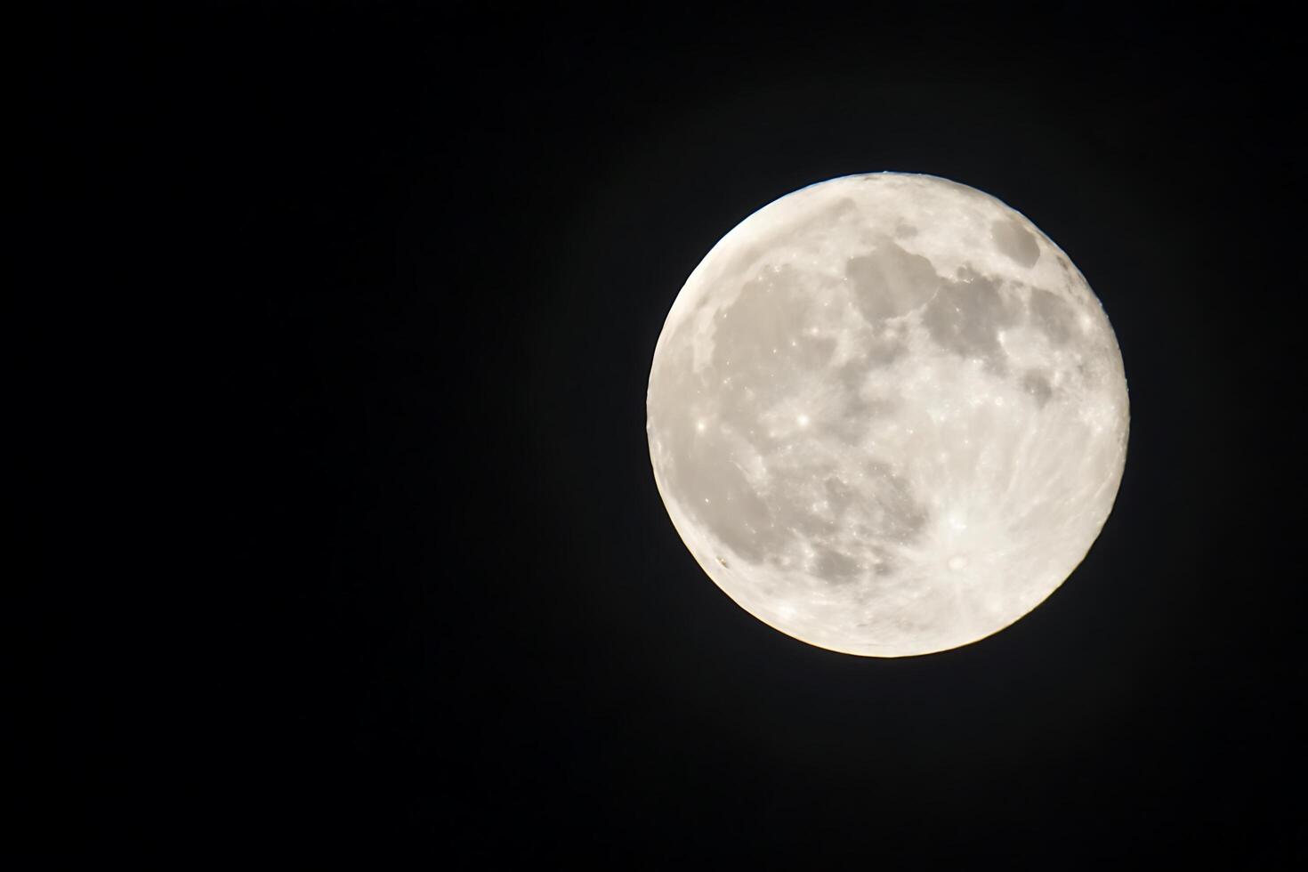 the full moon is seen in the dark sky photo
