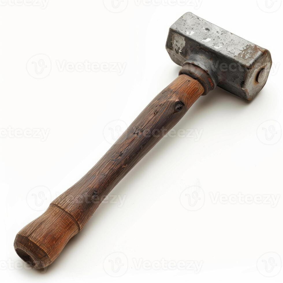 Old sledge hammer with wooden handle lying on white background photo