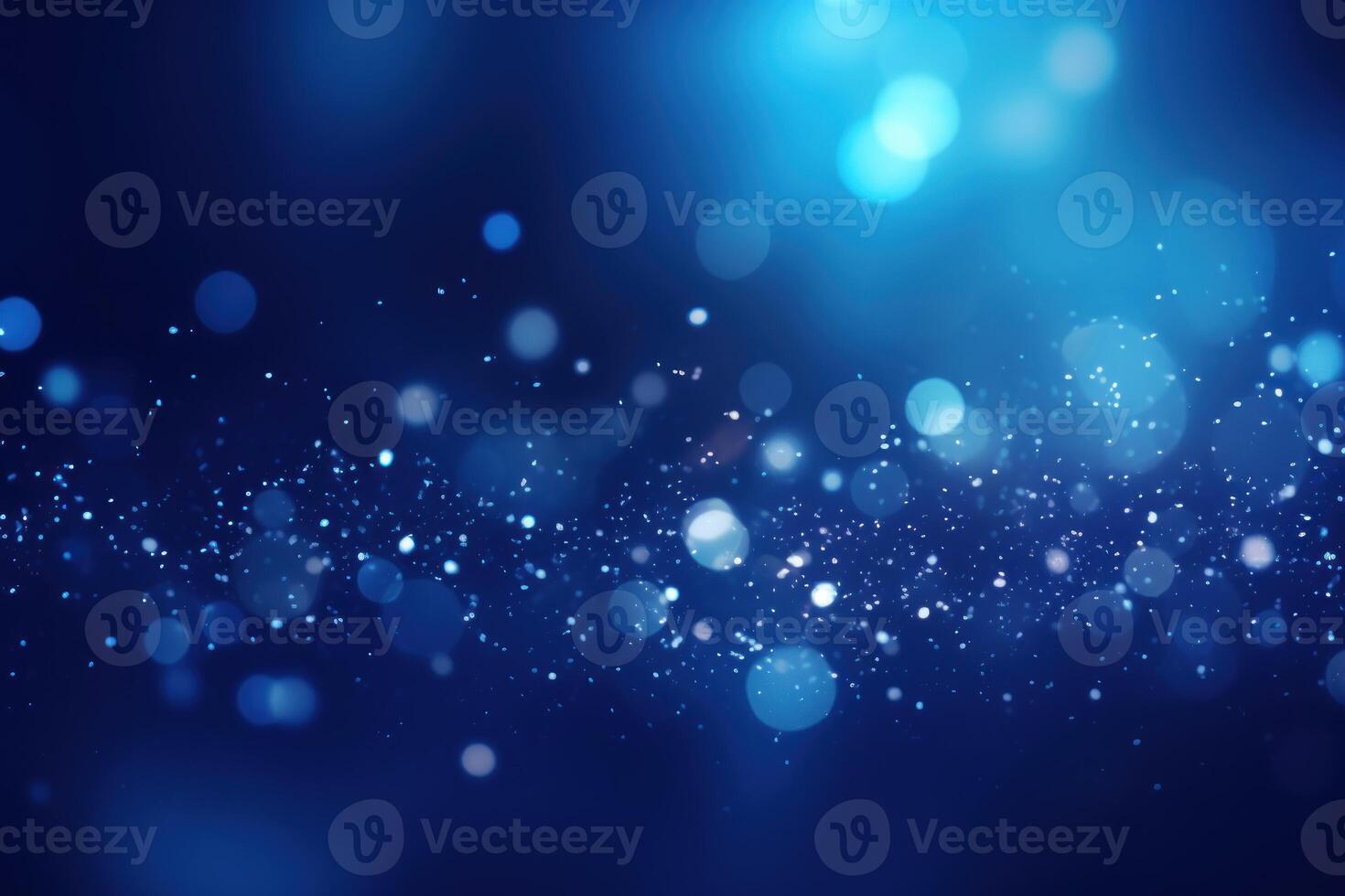 Abstract blue bokeh background with floating dust particles photo