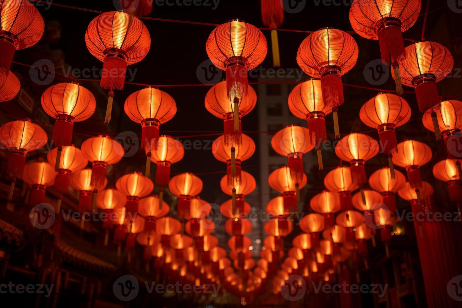 Rows of illuminated red lanterns creating a festive atmosphere at night photo