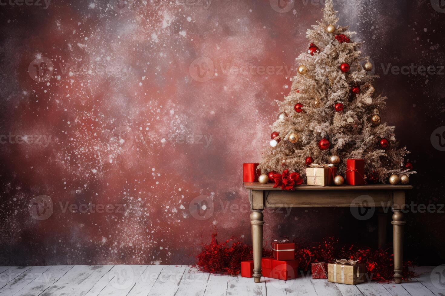 Christmas tree with red and gold decorations and presents on a wooden table photo