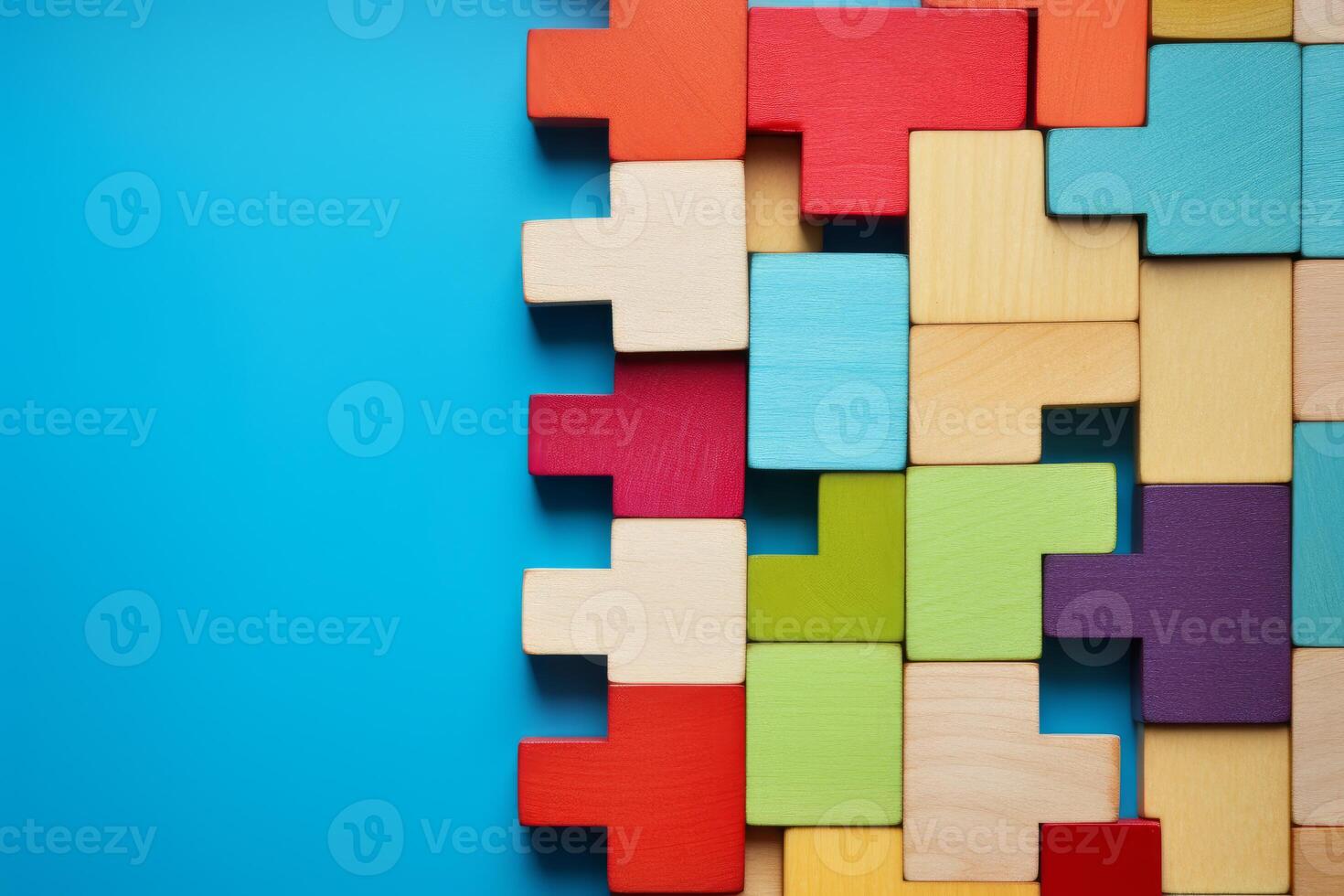 Colorful wooden blocks creating a geometric pattern on blue background photo