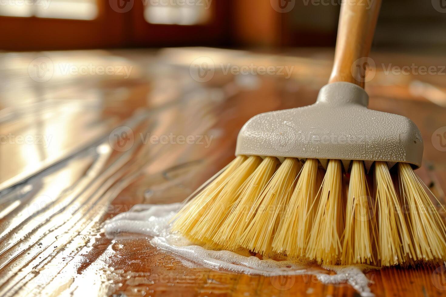 Janitor cleaning wooden floor with brush and soap photo