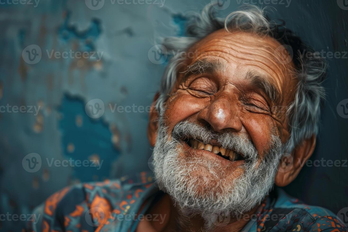 Happy senior man smiling with eyes closed, showing happiness and joy photo