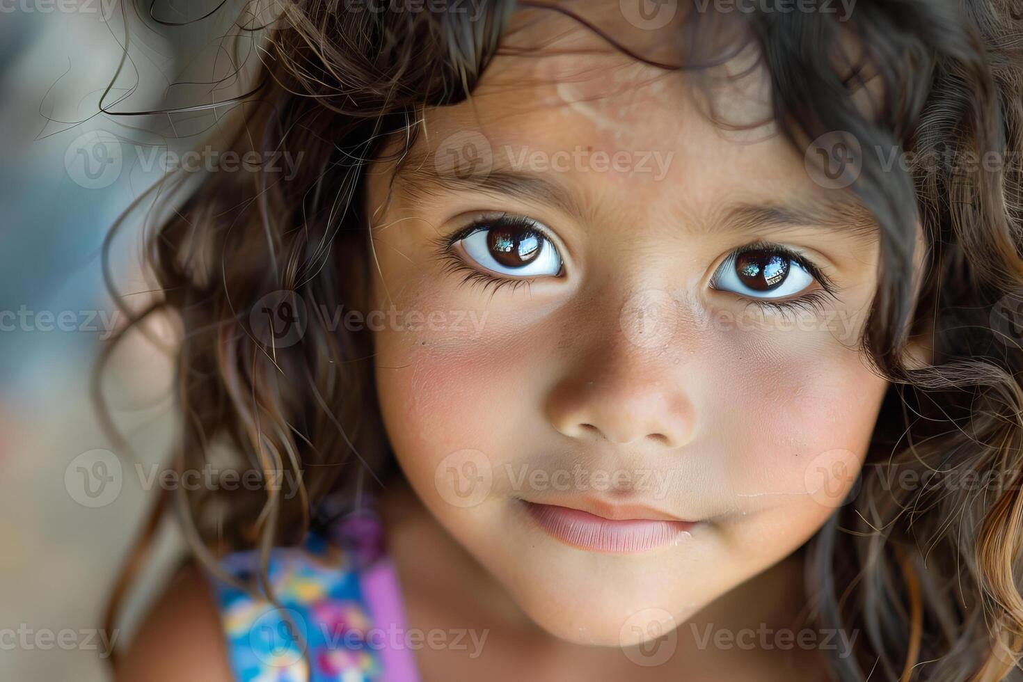 Portrait of young girl expressing curiosity and innocence photo